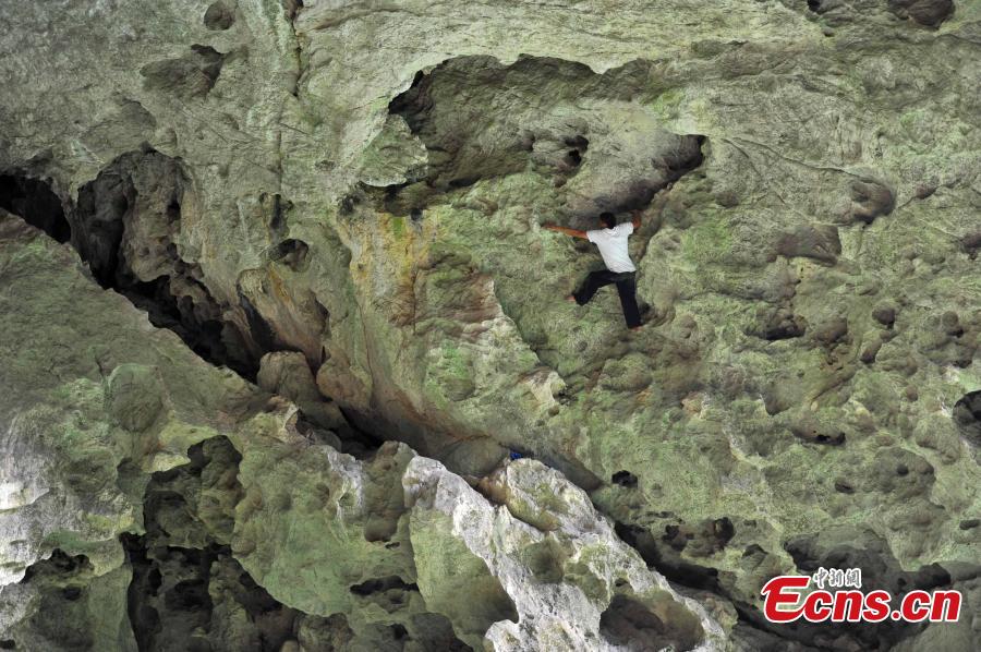 Real life spiderman scales cliff without safety equipment