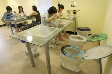 Diners eat at a toilet-themed restaurant in Hangzhou