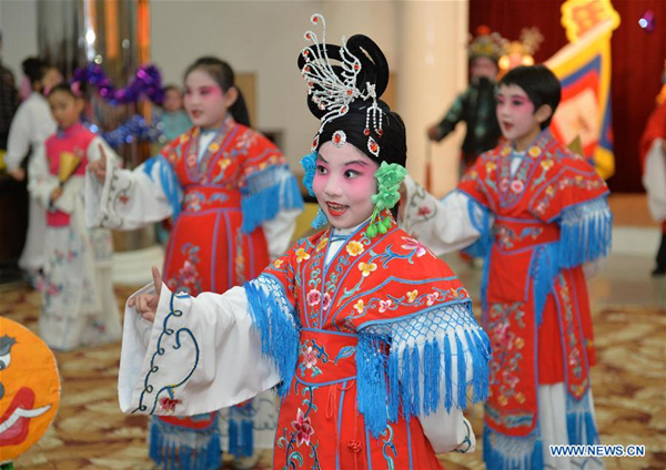 Children perform traditional Chinese Peking Opera