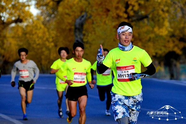 Runners cross rare desert poplar forest