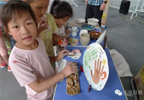Taicang firm holds summer camp for left-behind children