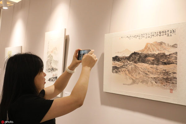 Yixing art master hosts first solo exhibition