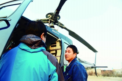 Checking power lines in NE China via helicopter