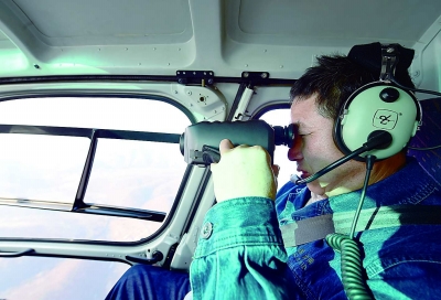 Checking power lines in NE China via helicopter