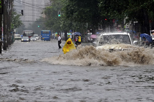 Floods overwhelm streets in NE China