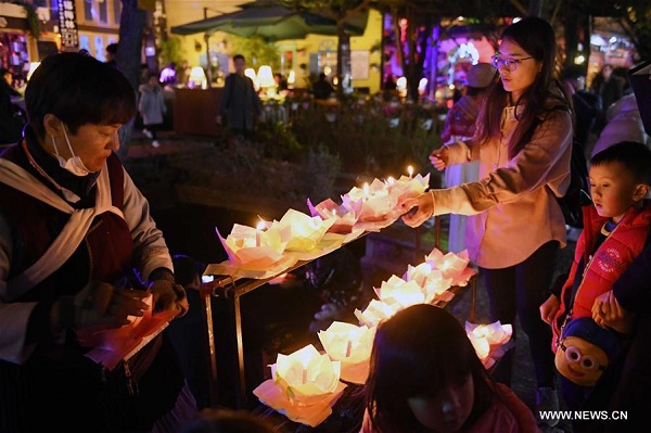 Tourists visit Lijiang's Old Town in Southwest China's Yunnan