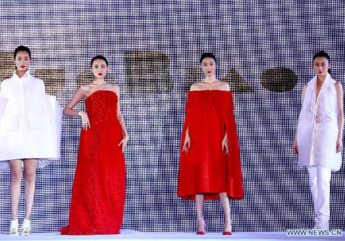 Models present creations at Qingdao Int'l Fashion Week