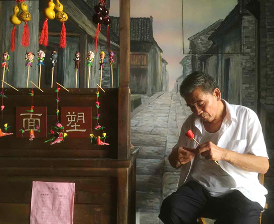 Dough figure artist at Zhongdu Folk Museum