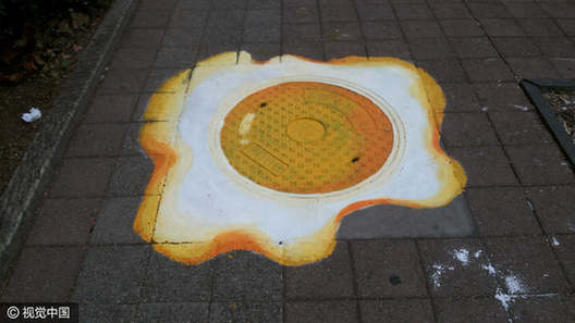 Students turn manhole covers into works of art