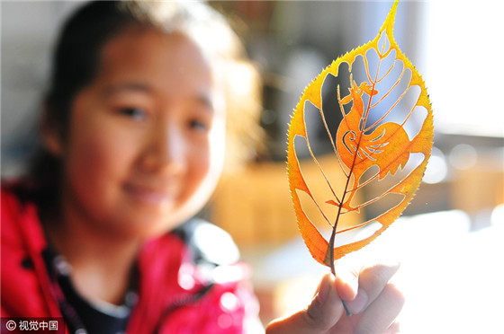 Vivid leaf carvings welcome Year of Rooster