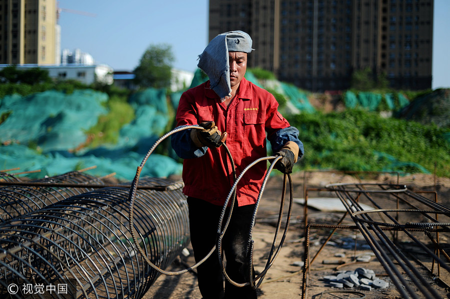 Welders cover up despite summer heat