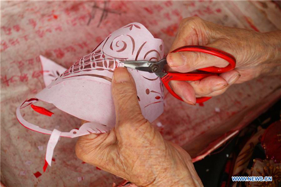 In pics: papercuttings made by 103-year-old woman