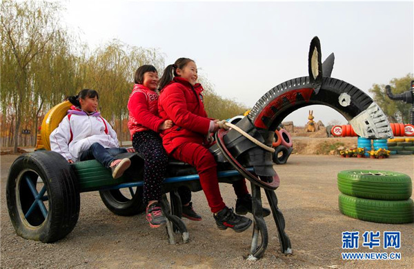 Shandong farmers make cartoon characters out of used tires