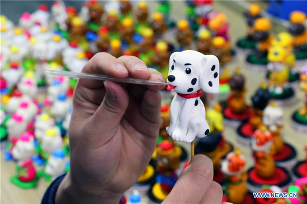 Chinese artist makes 2018 pieces of doggie dough figurines ahead of New Year