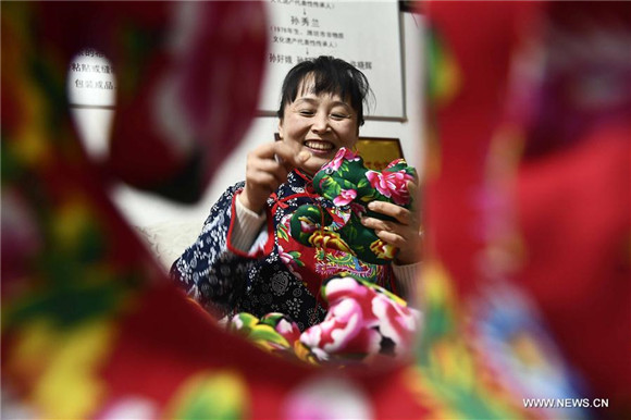 Female intangible cultural heritage inheritors mark Int'l Women's Day in Shandong