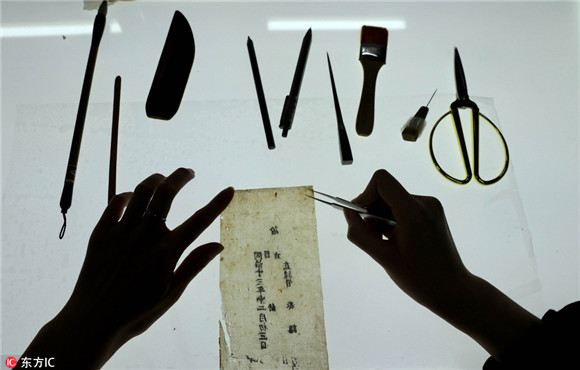 Young but skillful hands restore 300 old books