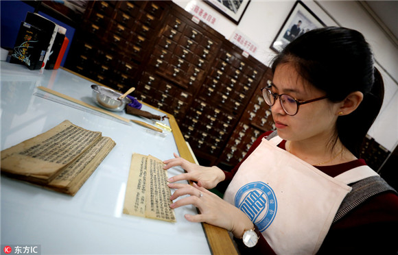 Young but skillful hands restore 300 old books