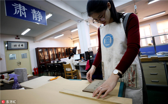 Young but skillful hands restore 300 old books
