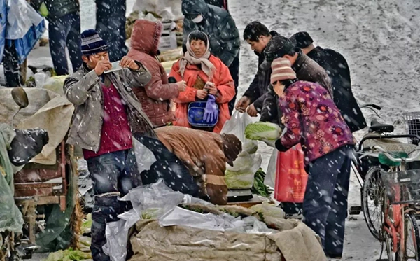 Photo exhibit marks Shandong's 40 years of reform and opening-up