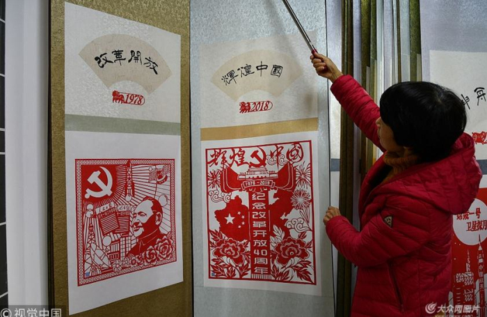 Yantai artist shows charms of paper-cutting