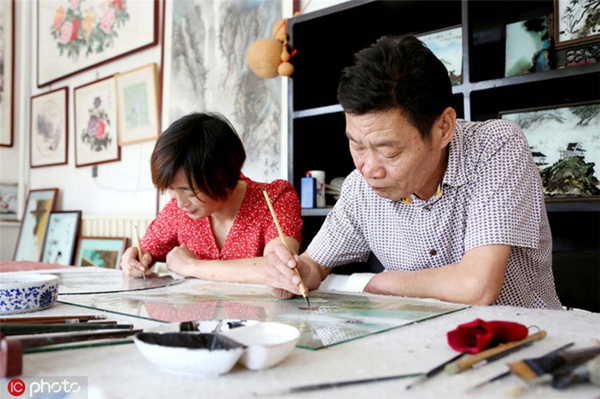 Folk artist inherits glass painting technique