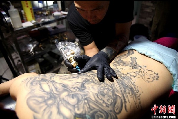 Tattoo artist in China