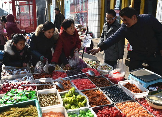 People prepare for the coming Spring Festival