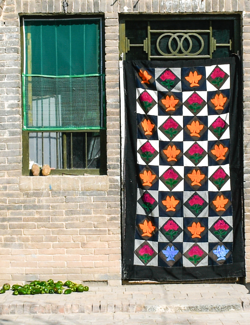 Patchwork winter door covers brighten North China homes