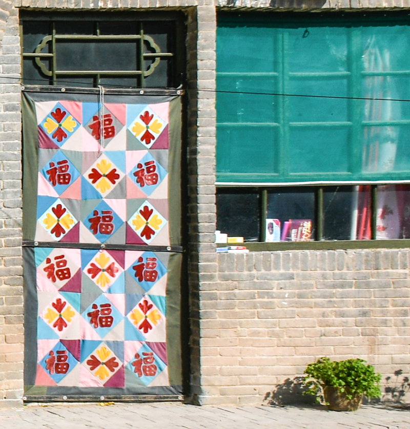 Patchwork winter door covers brighten North China homes