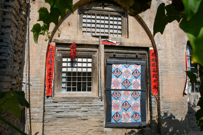 Patchwork winter door covers brighten North China homes