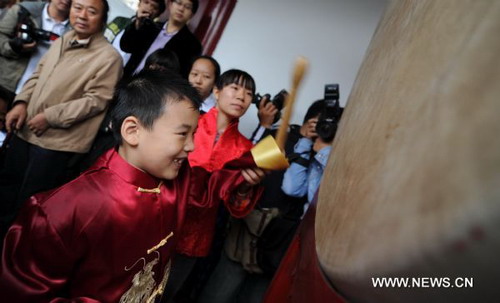 Chilidren take part in traditional first writing ceremony