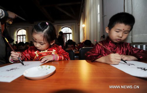 Chilidren take part in traditional first writing ceremony