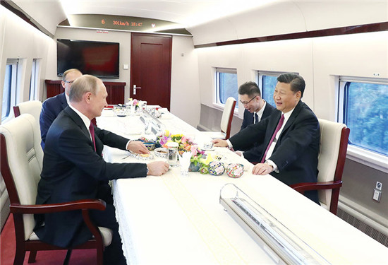 Putin's China trip: High-speed train, ice hockey, local snacks