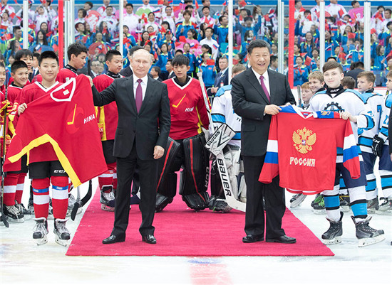 Putin's China trip: High-speed train, ice hockey, local snacks