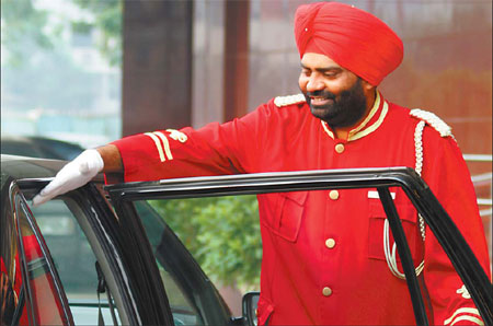 Serving up happiness: Indian bellhop loves life in Beijing