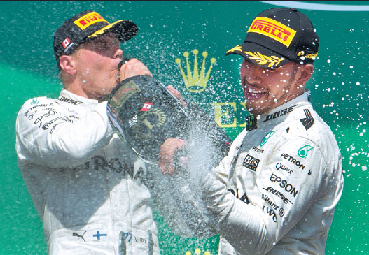 Hamilton celebrating his Canadian six-pack