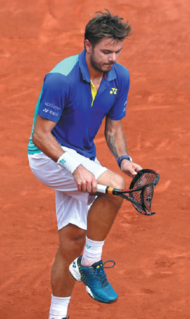 Stifled Stan bows to king of clay