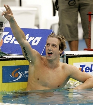 Australia's Nick D'Arcy waves after winning the Men's 200-meter Butterfly at the Australian Swimming Championships in Sydney on March 25. AOC will decide whether Nick D'Arcy is allowed to compete in this year's Beijing Olympics following assault charges brought against him, Swimming Australia (SAL) said on Friday. [Agencies]