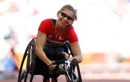 Canada&apos;s Michelle Stilwell reacts after women&apos;s 200M T52 final at the National Stadium，also known as the Bird&apos;s Nest，during the Beijing 2008 Paralympic Games in Beijing, Sept. 11, 2008. Stilwell won the gold medal with 36.18 seconds.(