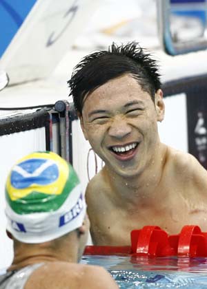 China&apos;s He Junquan(R) smiles to Daniel Dias of Brazil after the SM5 final of men&apos;s 200m individual medley during the Beijing 2008 Paralympic Games at the National Aquatics Center in Beijing, Sept. 11, 2008. Dias claimed the title and He Junquan ranked the second in the event with a time of 3 mins 00.92 secs.