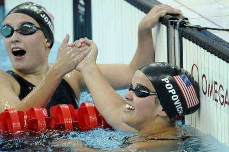 Erin Popovich(R) of the United States is congratulated after the S7 final of women&apos;s 400m freestyle during the Beijing 2008 Paralympic Games at the National Aquatics Center in Beijing, Sept. 11, 2008. Popovich claimed the title of the event and broke the Paralympic record with a time of 5 mins 17.41 secs.