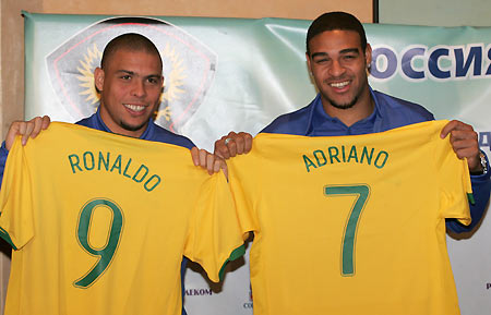 Brazilian strikers Ronaldo and Adriano pose with their jerseys during a news conference in Moscow, February 28, 2006. World champions Brazil have opted not to risk injured World Player of the Year Ronaldinho in Wednesday's friendly against Russia. [Reuters] 