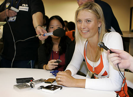 Maria Sharapova of Russia smiles while answering questions during a news conference at the Pacific Life Open in Indian Wells, California March 8, 2006.[Reuters]