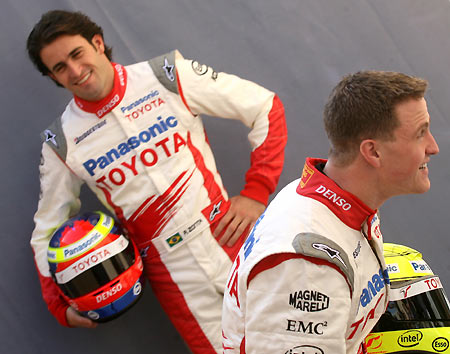 Toyota Panasonic Formula One drivers Ralf Schumacher (R) and Ricardo Zonta of Brazil trade places for the official photograph in the paddocks at the Sakhir race track for the Bahrain Formula One Grand Prix in Manama, Bahrain March 9, 2006. The Bahrain Grand Prix starts runs 10-12.[Reuters]