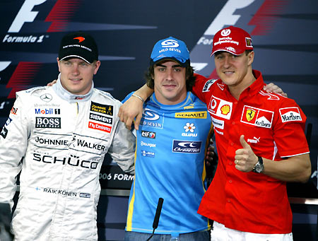 Ferrari Formula One driver Michael Schumacher of Germany (R), Renault driver Fernando Alonso of Spain (C) and McLaren driver Kimi Raikkonen of Finland pose after holding a news conference at the Sakhir race track for the Bahrain Formula One Grand Prix in Manama, Bahrain, March 9, 2006. The Bahrain Grand Prix starts runs 10-12.[Reuters]