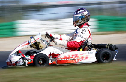Formula One driver Jarno Trulli of Italy drives a go-kart during a promotional event in Melbourne March 30, 2006.