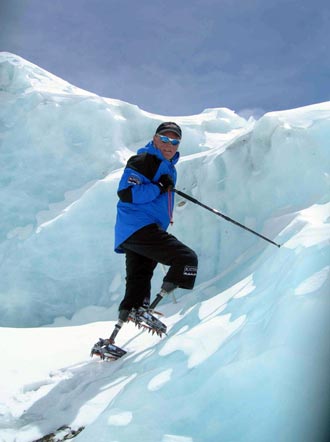 New Zealander Mark Inglis, a double amputee, trains on the North Col on Mount Everest in this April 28, 2006 handout file picture. Inglis became the first double amputee to conquer the world's highest peak when he reached the 8,850 metre (29,000 feet) summit with the aid of specially-adapted carbon fibre legs, which one of them broke during the ascent, on May 15, 2006. Inglis lost both of his legs to frostbite 24 years ago after being trapped in a snow storm on New Zealand's highest peak, Mount Cook. [Reuters]