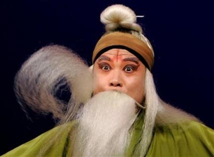 A Chinese performer of the Shaanxi Traditional Opera Research Institute performs stylized movement of his long beard during the rehearsal for his upcoming performance in Hong Kong Tuesday, May 16, 2006. The performance will be held from May 16 to 18. [AP Photo]