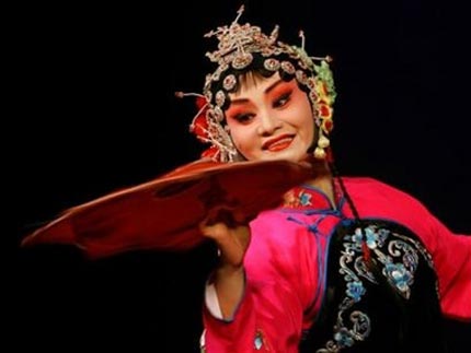 A Chinese performer of the Shaanxi Traditional Opera Research Institute spins a handkerchief during the rehearsal for her upcoming performance in Hong Kong Tuesday, May 16, 2006. The performance will be held from May 16 to 18. [AP Photo]