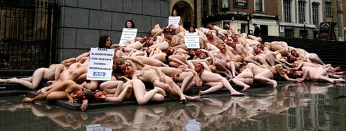 Nude PETA (People for the Ethical Treatment of Animals) activists protest against the Queen's palace guards' bearskin hats at Peter's Hill in central London May 21, 2006. The banner reads "Bears slaughtered for the Queen's guards". 